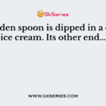 A wooden spoon is dipped in a cup of ice cream. Its other end…