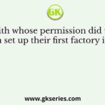 With whose permission did the English set up their first factory in Surat?